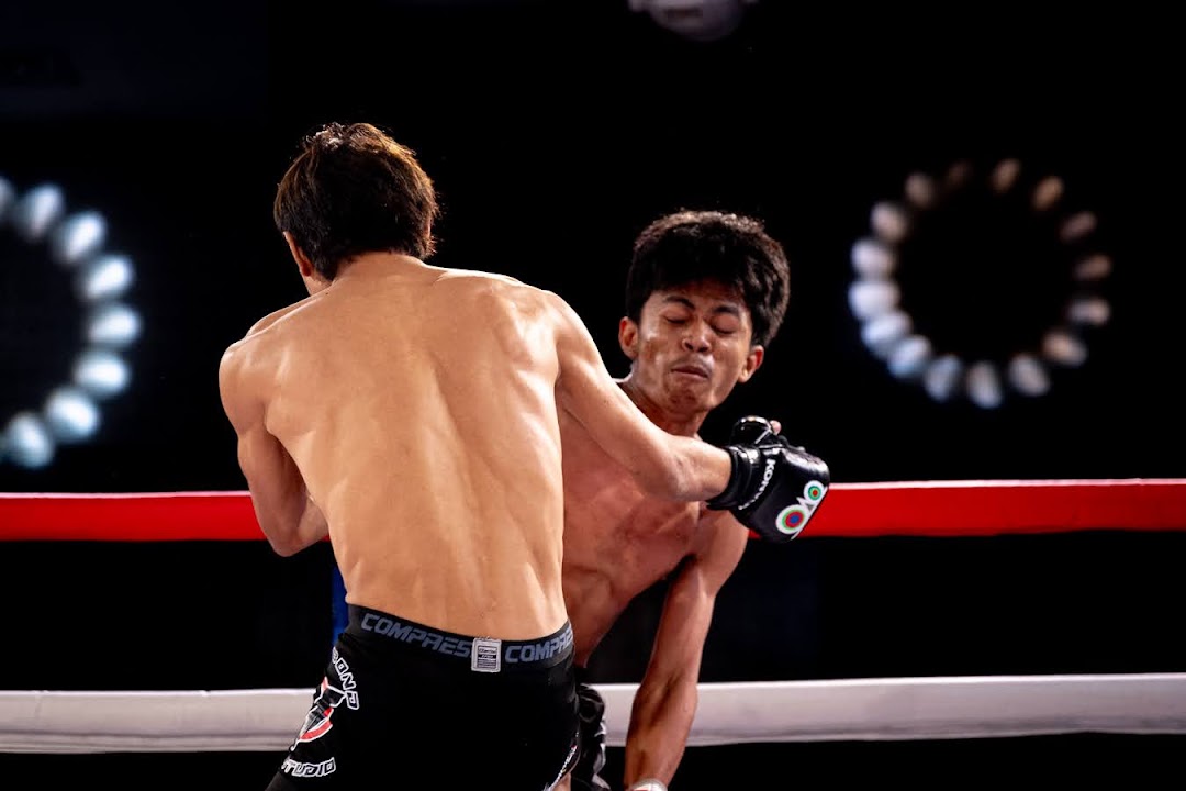 An MMA fighter lands a clean punch during a Konvoy fight in Cebu.