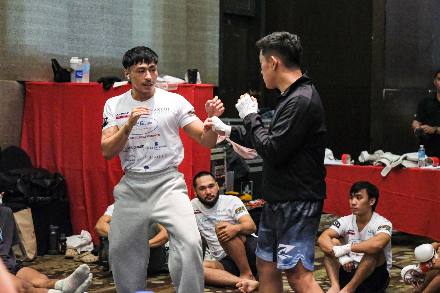 Two fighters practice their stance and hand position backstage before KONVOY 03.